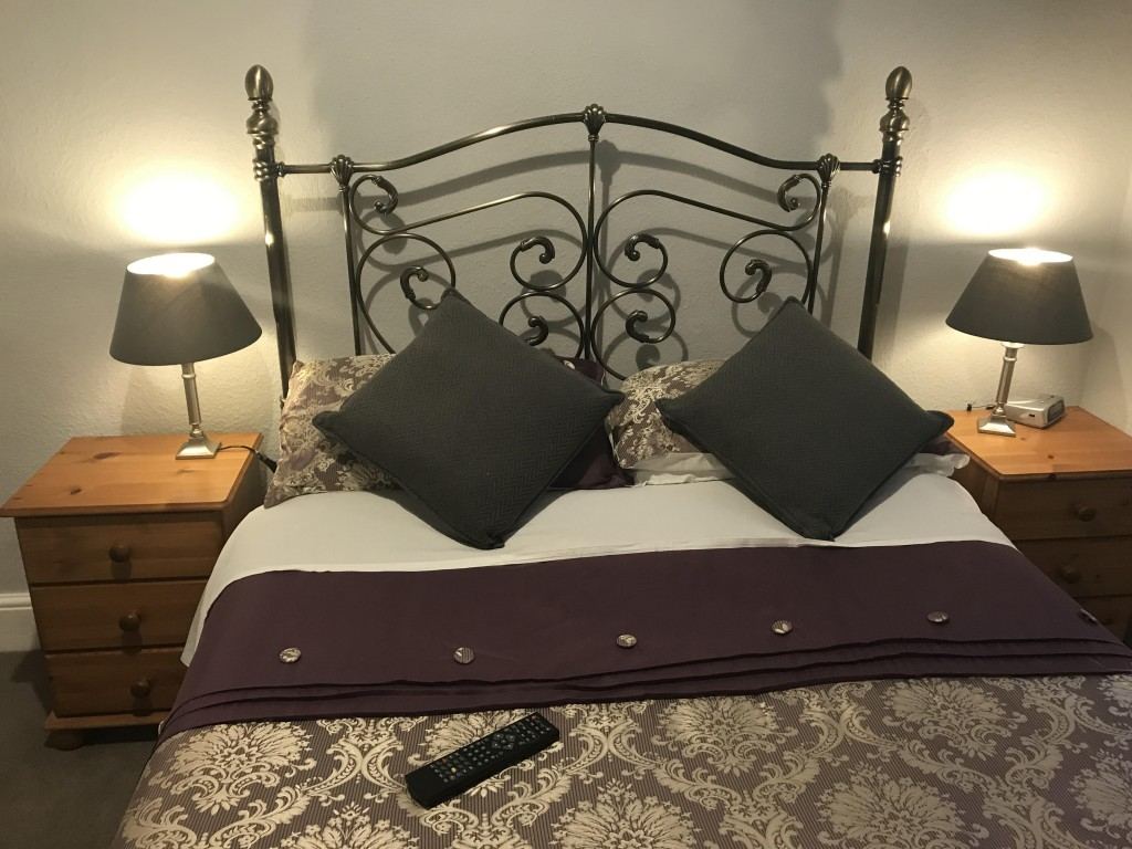 Double bedroom with metal headboard